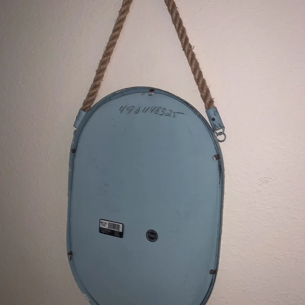 Oval Mirror with Blue metal surrounding and rope to hang